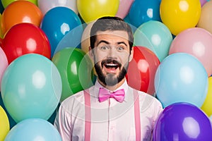 Photo of funny crazy guy open mouth colorful design atmosphere surprised birthday party formalwear pink shirt bow tie