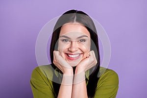 Photo of funny dreamy young woman wear khaki outfit arms cheeks smiling isolated violet color background