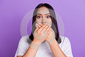 Photo of funny excited crazy girl panic wearing white t shirt closed mouth shocked see spider at home isolated on purple