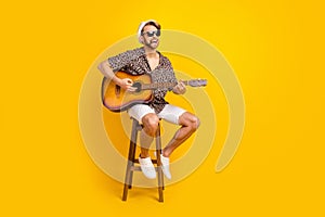 Photo of funny funky gentleman dressed shirt dark glasses headwear playing guitar singing smoking isolated yellow color