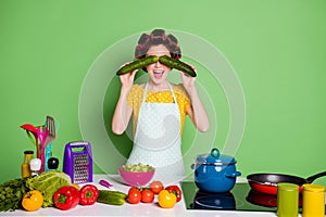 Photo of funny funny girl prepare fresh organic supper close cover eyes cucumber have table tomato pepper ingredients