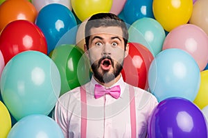 Photo of funny handsome guy open mouth colorful design atmosphere surprised birthday party formalwear pink shirt bow tie
