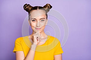 Photo of funny lady youngster looking tricky having crazy but smart idea hold arm on chin wear yellow t-shirt isolated