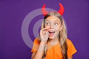 Photo of funny little lady headband horns on head sharing rumours wit classmates chatterbox october party wear orange t-