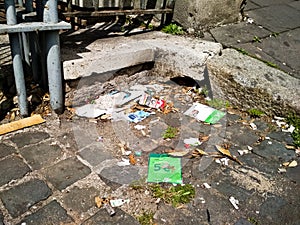 Photo of garbage lying on the ground in streets