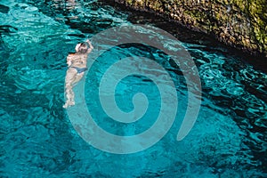 Girl at Hoyo Azul in Punta Cana, Dominican Republic photo