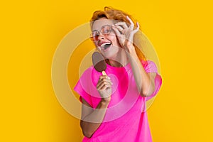 photo of glad woman with icelolly ice cream at summer. woman with icelolly ice cream