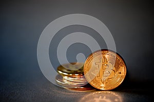 Photo Golden Bitcoins On Blue Background. Trading Concept Of Crypto Currency