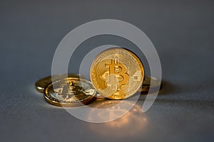 Photo Golden Bitcoins On Blue Background. Trading Concept Of Crypto Currency