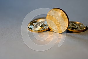 Photo Golden Bitcoins On Blue Background. Trading Concept Of Crypto Currency