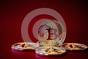 Photo Golden Bitcoins On Red Background. Trading Concept Of Crypto Currency