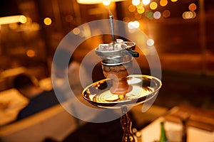 Photo of golden hookah bowl