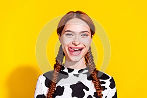 Photo of good mood hungry lady dressed cowskin top stick out licking lips isolated yellow color background