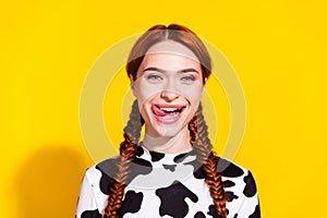 Photo of good mood hungry lady dressed cowskin top stick out licking lips isolated yellow color background photo