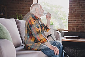 Photo of good mood man pensioner wear checkered shirt drinking fresh water glass indoors house room