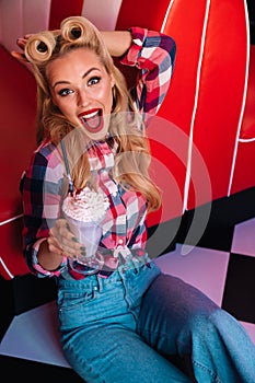 Photo of gorgeous cheerful woman drinking milkshake