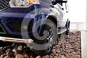 Photo on gravel stones wheels SUV car