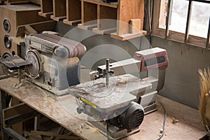 Photo of  grinding machine and electric jigsaw machine in a workshop