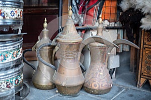 A photo of a group of Arabic traditional vintage brass coffee and tea jug