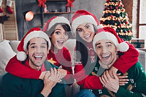 Photo of group astonished positive people cuddle open mouth magic christmas time atmosphere house indoors