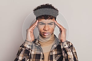 Photo of guy fingers temples closed eyes sad face headache wear checkered shirt rollneck  grey color background