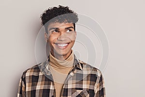 Photo of guy interested look empty space white smile wear plaid shirt rollneck isolated grey color background