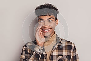 Photo of guy palm mouth look side empty space cunning wear plaid shirt rollneck isolated grey color background
