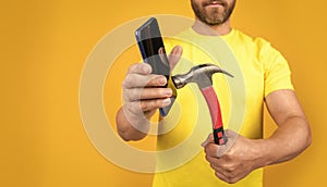 photo of hack the phone screen with hammer, advertisement.