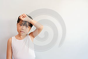 A photo of a half-up girl raising her hand during a morning exercise pose with a bright face.