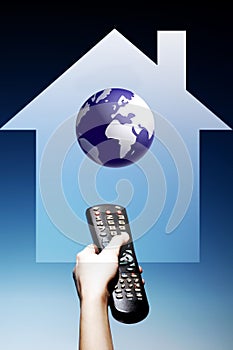 Photo of Hand Holding Television Remote Control in The Home from