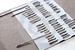 Photo of hand-sewing needles types. Close-up view