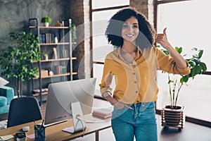 Photo of happy adorable lady advisor wear shirt showing thumb up indoors workplace workshop