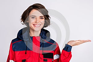 Photo of happy beautiful smiling cheerful girl paramedic hold hands recommendation isolated on grey color background