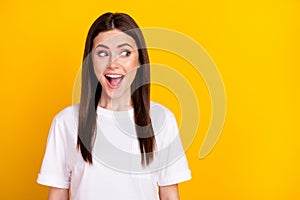 Photo of happy excited crazy amazed beautiful woman look copyspace see huge sale isolated on yellow color background