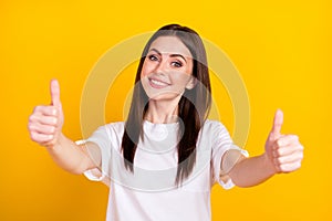 Photo of happy good mood positive lovely beautiful girl showing you thumb-up good job isolated on yellow color