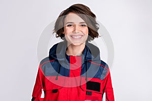 Photo of happy positive smiling beautiful cheerful woman paramedic rescuer isolated on grey color background