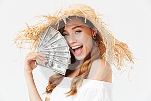 Photo of happy rich woman 20s wearing big straw hat rejoicing an