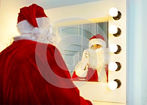 Photo of happy Santa Claus talking to the phone