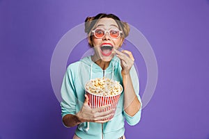 Photo of hipster girl 20s in sunglasses screaming and holding bu