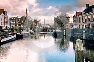 Photo of the historic Delfshaven with beautiful colored clouds in Rotterdam