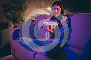 Photo of homey chinese lady eat popcorn movie night watch horror scary movie hiding eyes afraid look on blood sit cosy