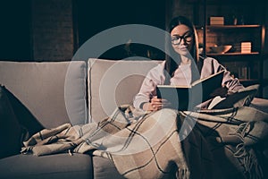 Photo of homey pretty lady read love novel to end interested book worm addiction sitting couch covered warm plaid photo