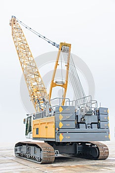 Photo of huge crawler crane with isolated background