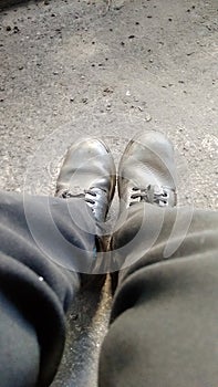 Photo of human leg with blackboot