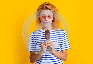 photo of hungry girl with icelolly ice cream at summer. girl with icelolly ice cream photo