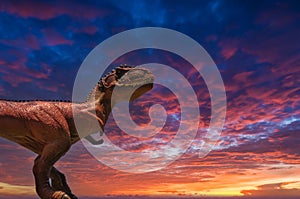 Dinosaur T-Rex with dramatic sky (toy photography)