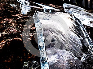 photo of ice lying on a rock