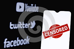 The photo illustrates the use of censorship in the popular social media Youtube, Twitter and Facebook. Censored in social network.