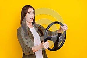 Photo of impressed lady riding superfast practice to ride automobile traveling around country isolated on yellow color