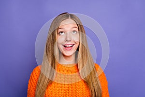 Photo of impressed positive girl toothy smile look interested up empty space ad isolated on violet color background